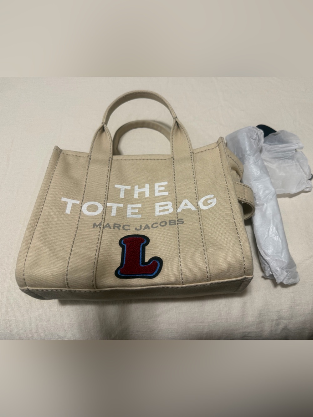 The Marc Jacob small tote in beige.